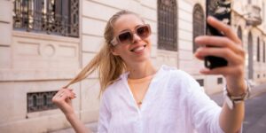a woman taking a selfie with her cell phone